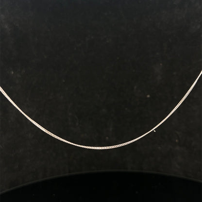 9ct white gold chain weighing 1.5g, featuring a delicate link design, by Reeves and Sons, shown in the product image.
