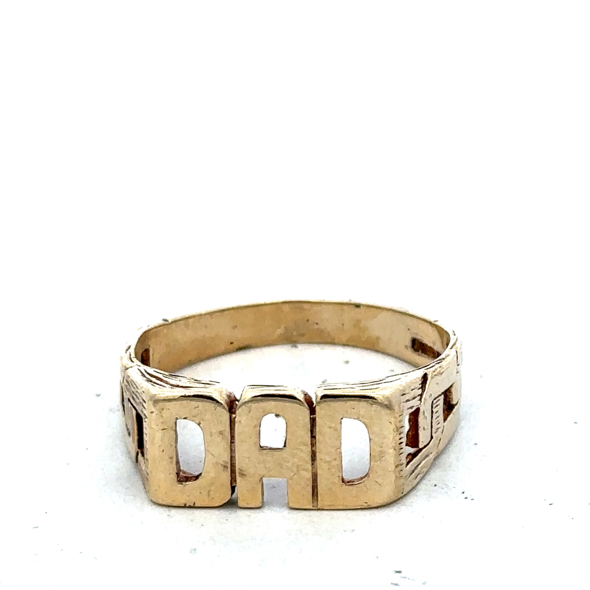 9ct yellow gold DAD ring in size X1/2 with engraved lettering, crafted by Reeves and Sons, shown on a plain background