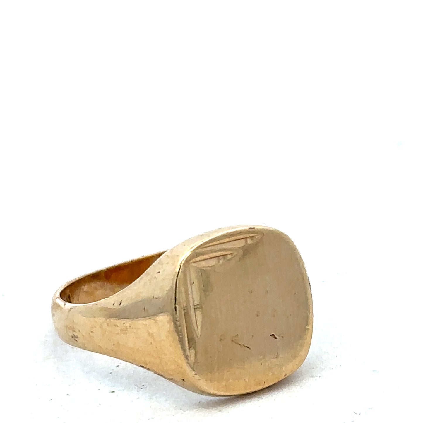 9ct yellow gold signet ring in size U with polished finish, featuring a smooth, flat top surface, by Reeves and Sons.