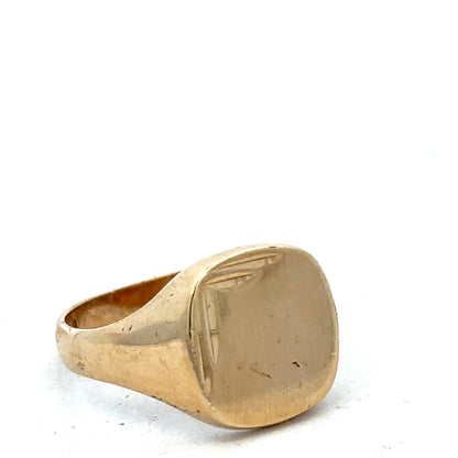 9ct yellow gold signet ring in size U with polished finish, featuring a smooth, flat top surface, by Reeves and Sons.
