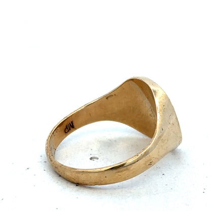 9ct yellow gold signet ring in size U from Reeves and Sons, featuring a smooth polished surface and classic design.