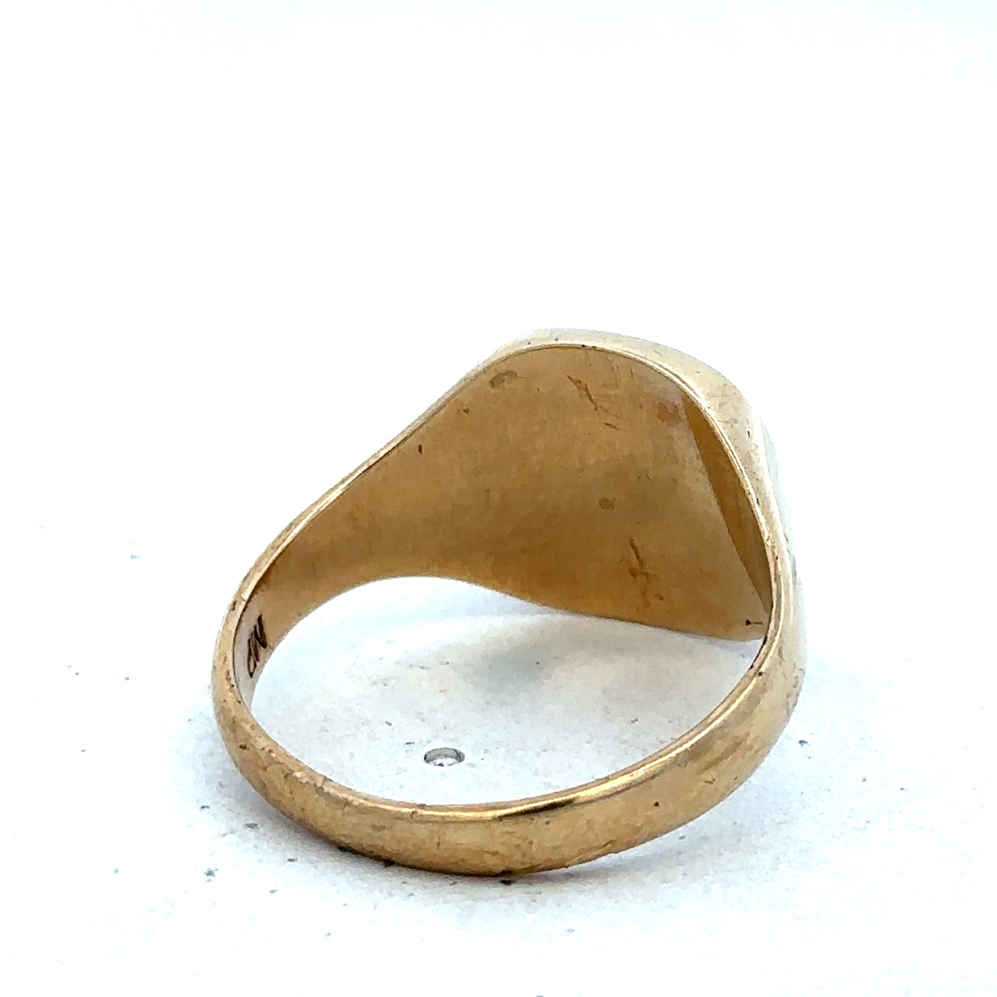 9ct yellow gold signet ring in size U with engraved flat face, crafted by Reeves and Sons, displayed on a neutral background.