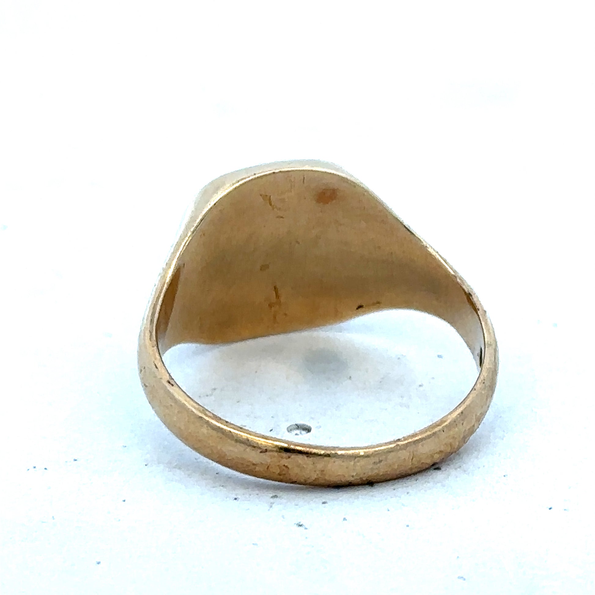 9ct yellow gold signet ring in size U with engraved face, crafted by Reeves and Sons, displayed on a neutral background.
