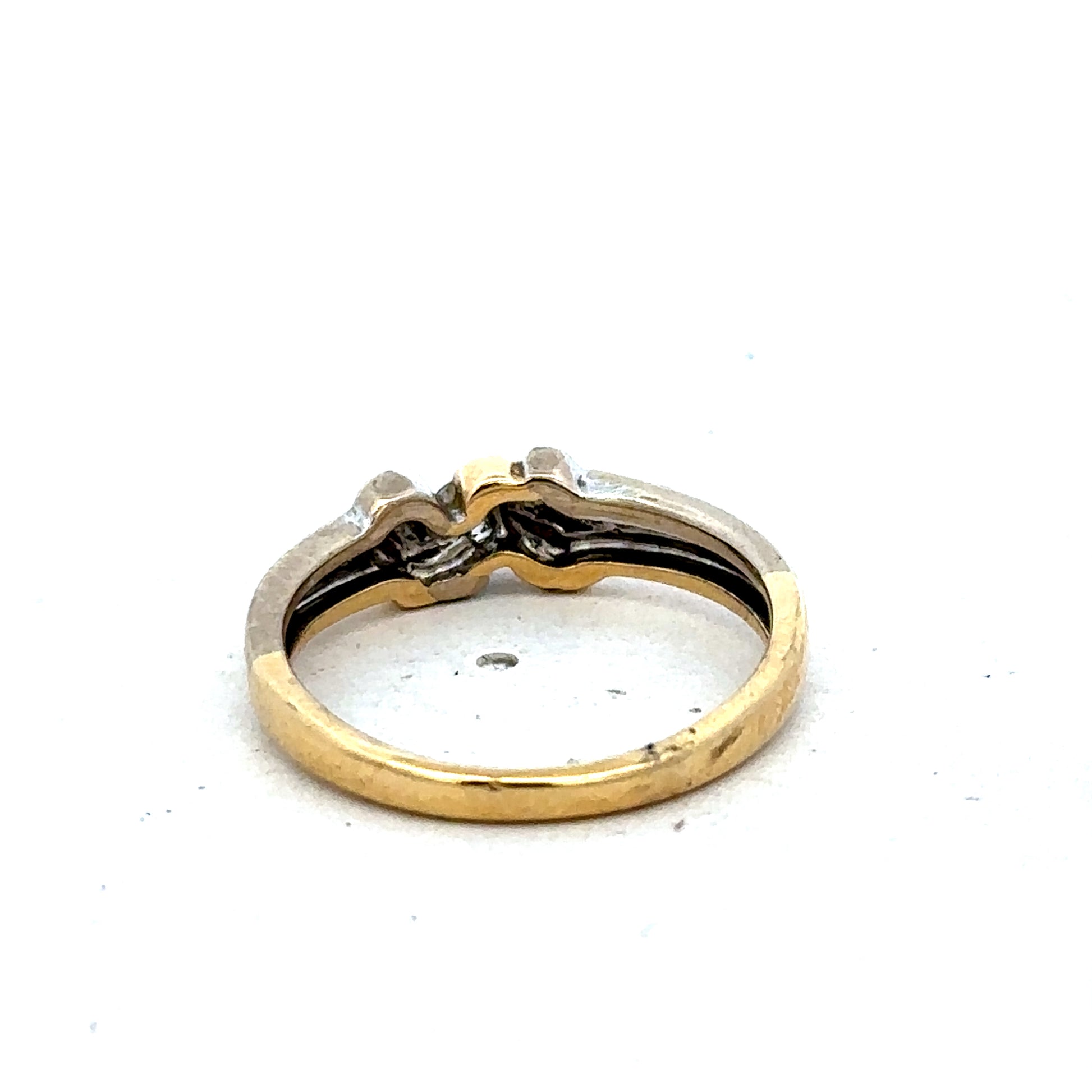 18ct yellow gold diamond ring by Reeves and Sons, size N1/2, featuring sparkling diamonds and a polished band.