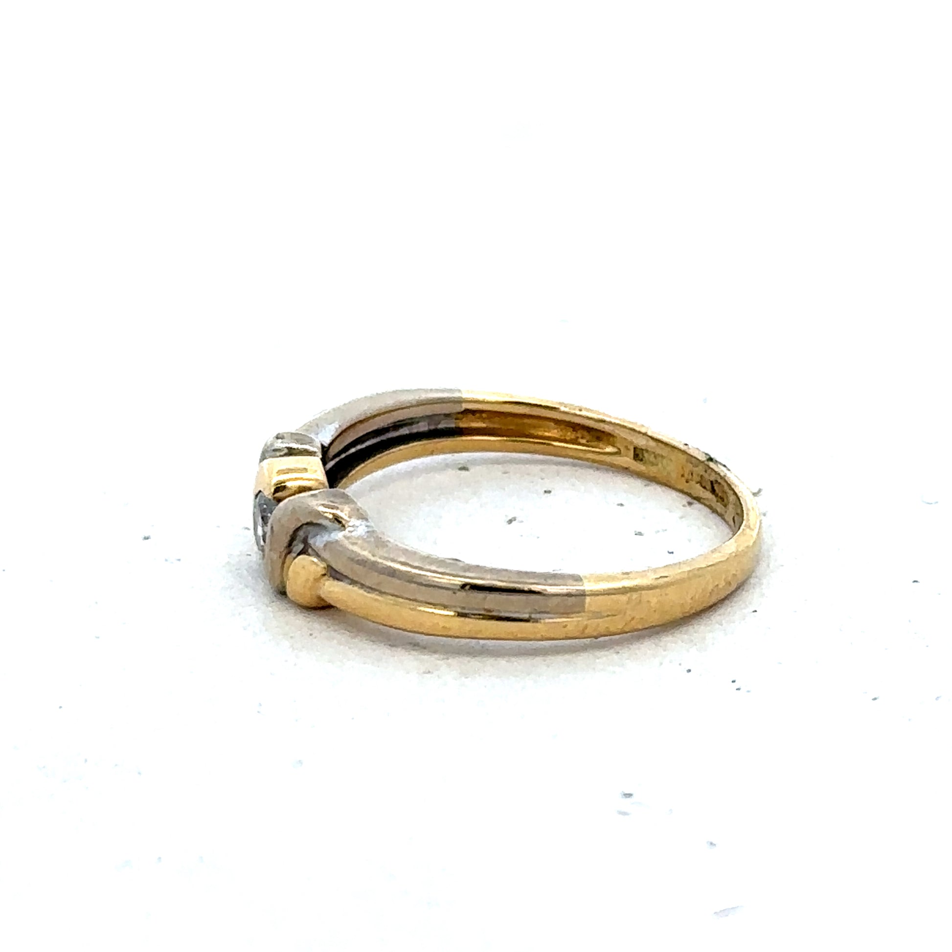 18ct yellow gold diamond ring by Reeves and Sons, size N1/2, featuring sparkling diamonds and a polished band.