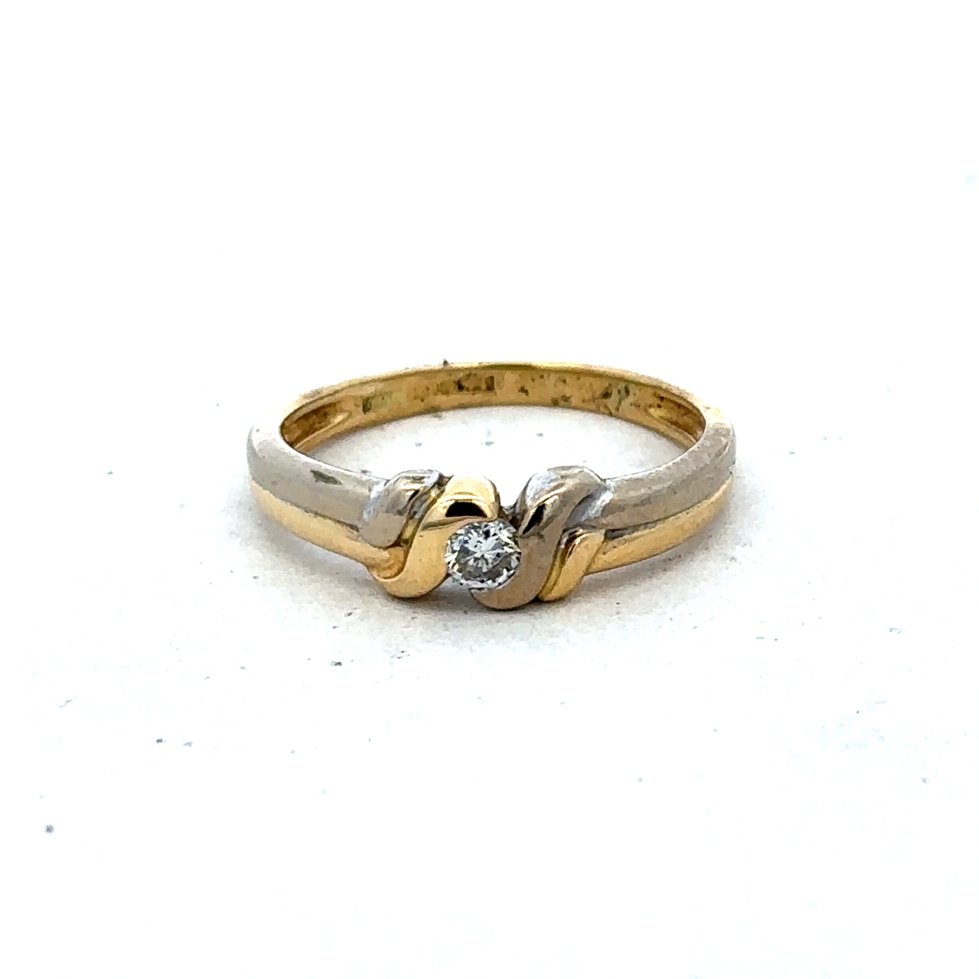 18ct yellow gold diamond ring by Reeves and Sons, size N1/2, featuring sparkling diamonds and elegant craftsmanship.