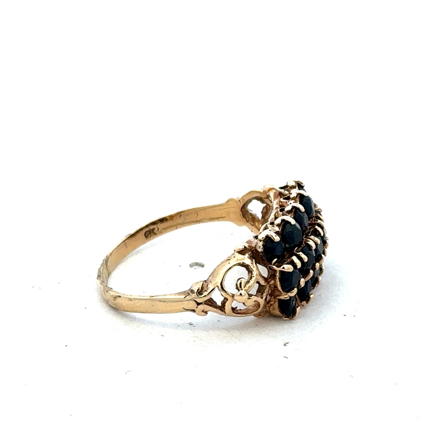 9ct yellow gold sapphire ring size P by Reeves and Sons, featuring a vibrant blue sapphire gemstone on a polished band
