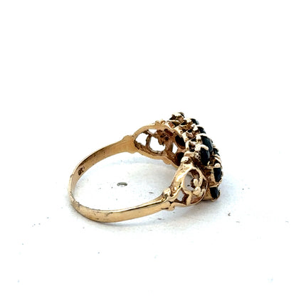 9ct yellow gold sapphire ring size P by Reeves and Sons, featuring a central blue sapphire gemstone and intricate band details.