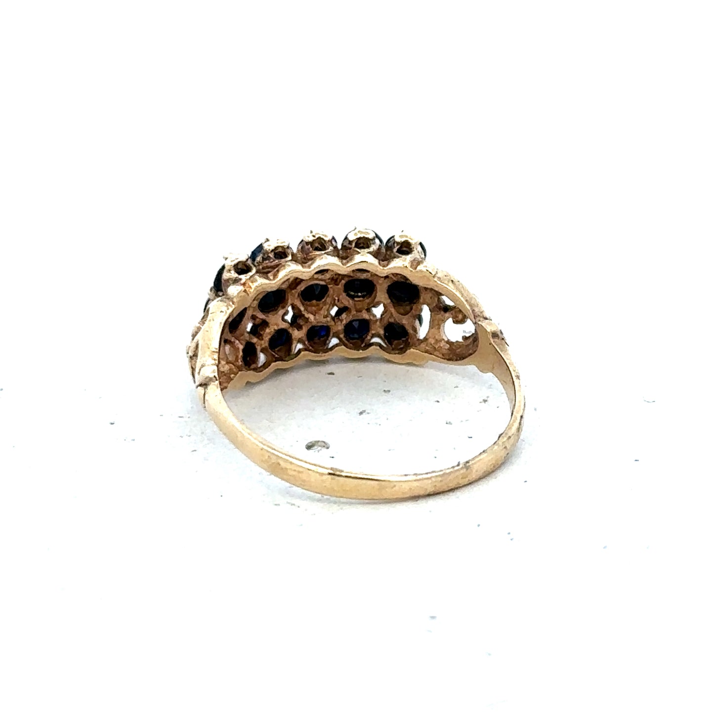 9ct yellow gold sapphire ring in size P with a polished band and a central blue sapphire gemstone.
