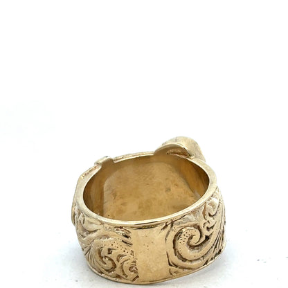 9ct yellow gold buckle ring in size X with a polished finish, crafted by Reeves and Sons, close-up of the detailed design.