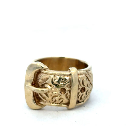 9ct yellow gold buckle ring in size X, featuring a polished finish and intricate buckle design by Reeves and Sons.