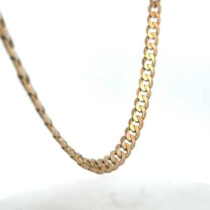 9ct yellow gold curb chain with a shiny finish, weighing 47.6g, from Reeves and Sons, displayed on a neutral background.