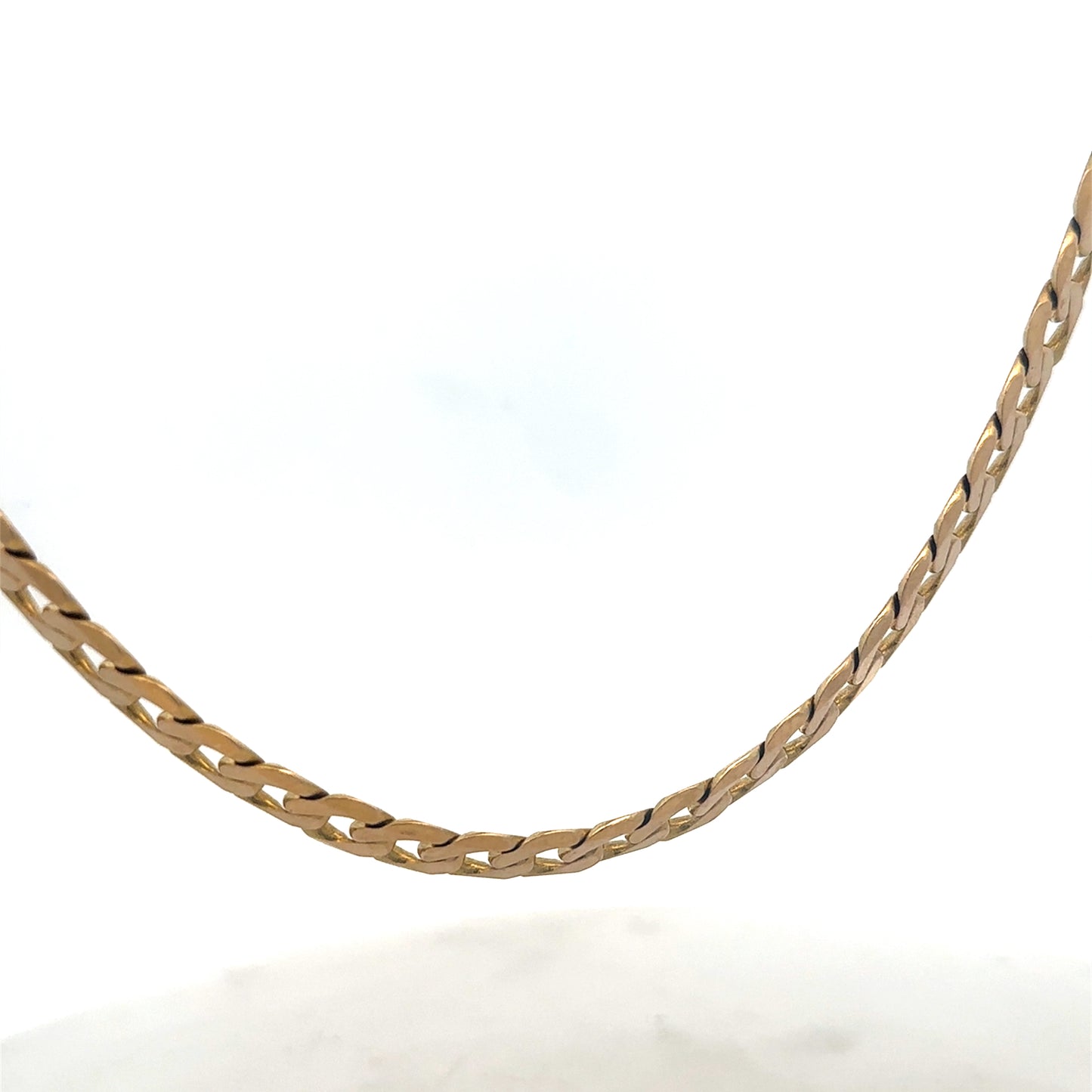 9ct yellow gold curb chain, Reeves and Sons, weighing 47.6g, showcasing a detailed close-up of the classic jewelry chain.