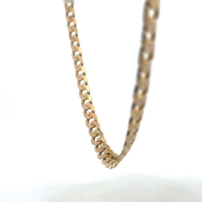 9ct yellow gold curb chain weighing 47.6g, crafted by Reeves and Sons, featuring interlinked oval-style links on a white background.