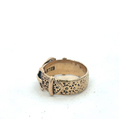 9ct yellow gold buckle ring size S1/2 by Reeves and Sons, close-up view showing polished gold finish and detailed buckle design.