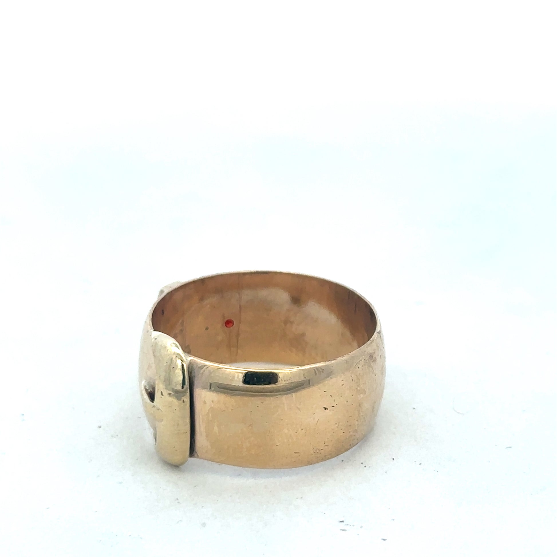 9ct yellow gold buckle ring in size Z2 with Reeves and Sons branding, featuring a polished gold finish and buckle design.