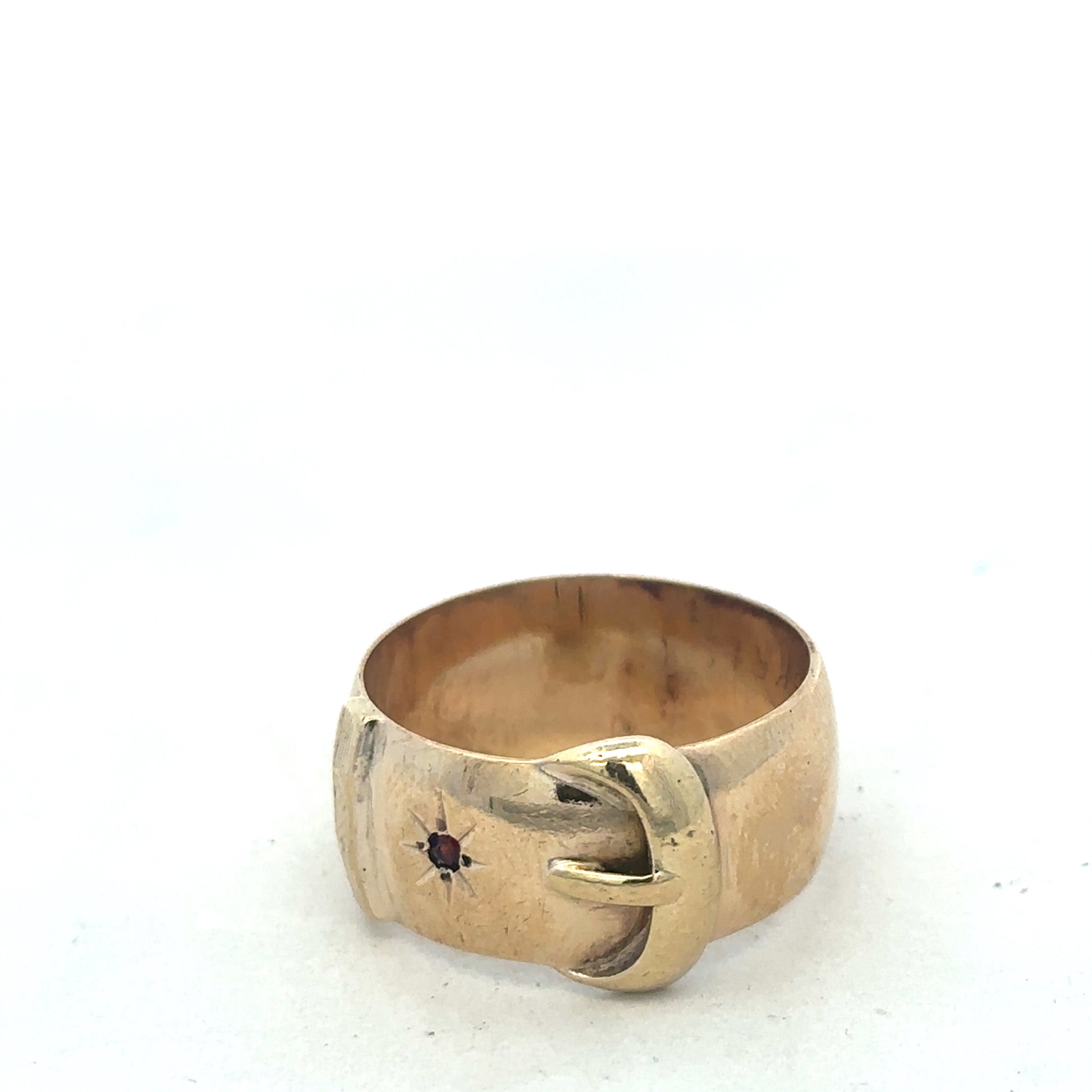 9ct yellow gold buckle ring in size Z2 with textured design, crafted by Reeves and Sons, shown in close-up detail.