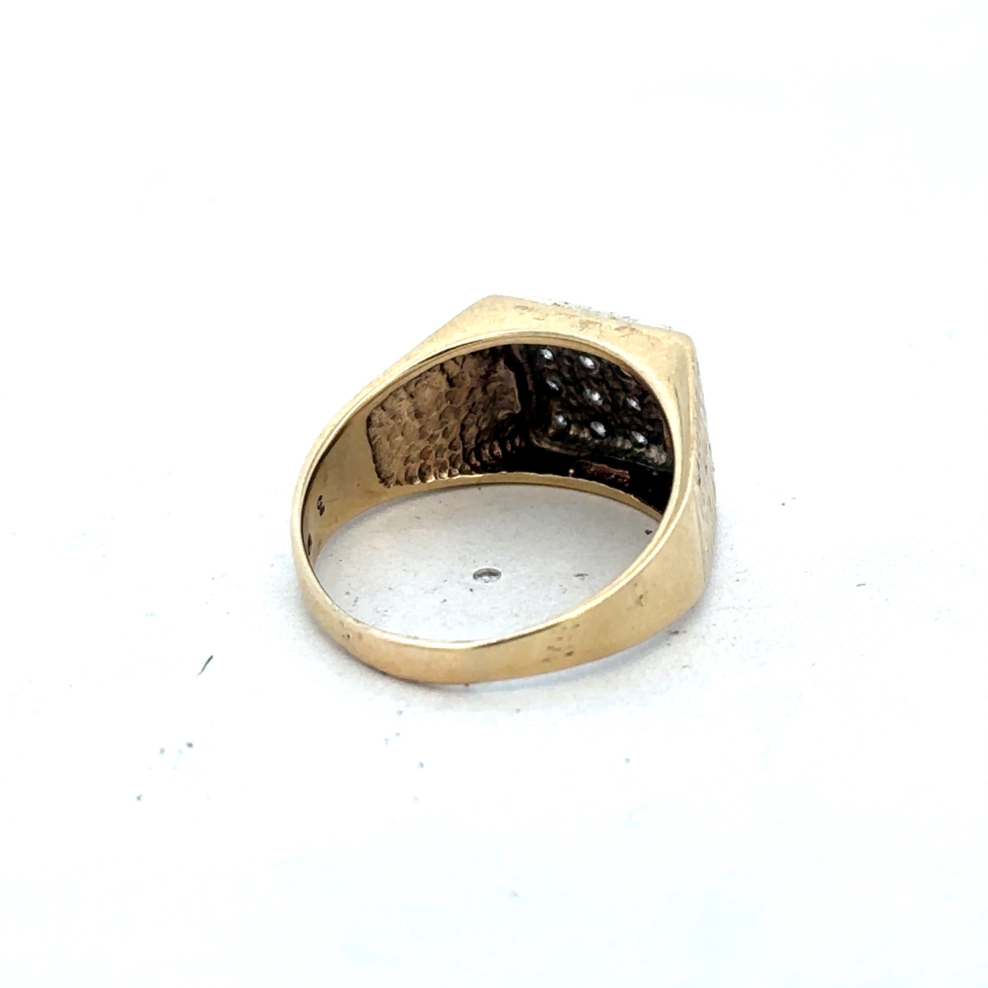9ct yellow gold diamond signet ring in size V by Reeves and Sons, featuring a polished gold band with a diamond accent.