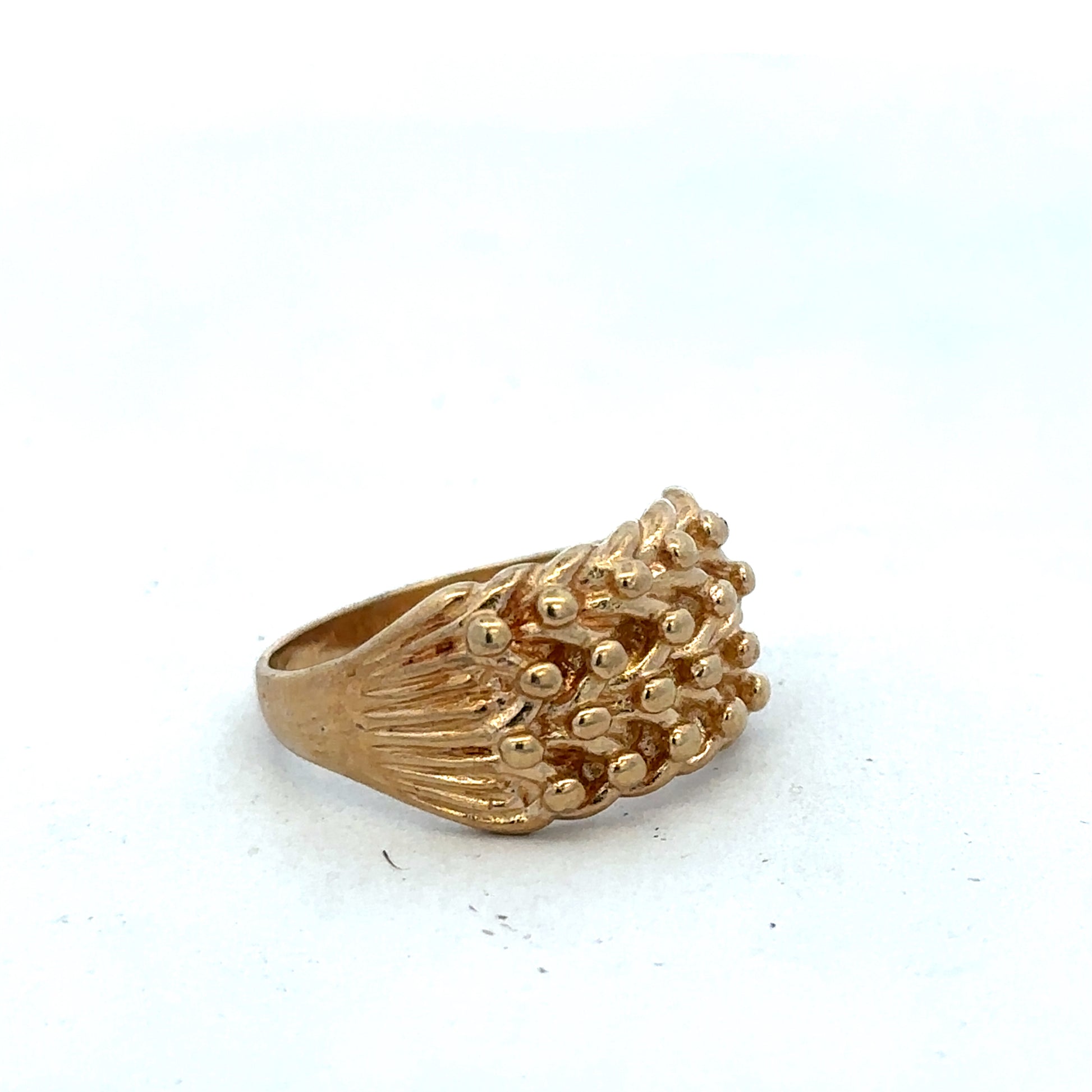 9ct yellow gold keeper ring in size U with a smooth band, crafted by Reeves and Sons, displayed on a neutral background.