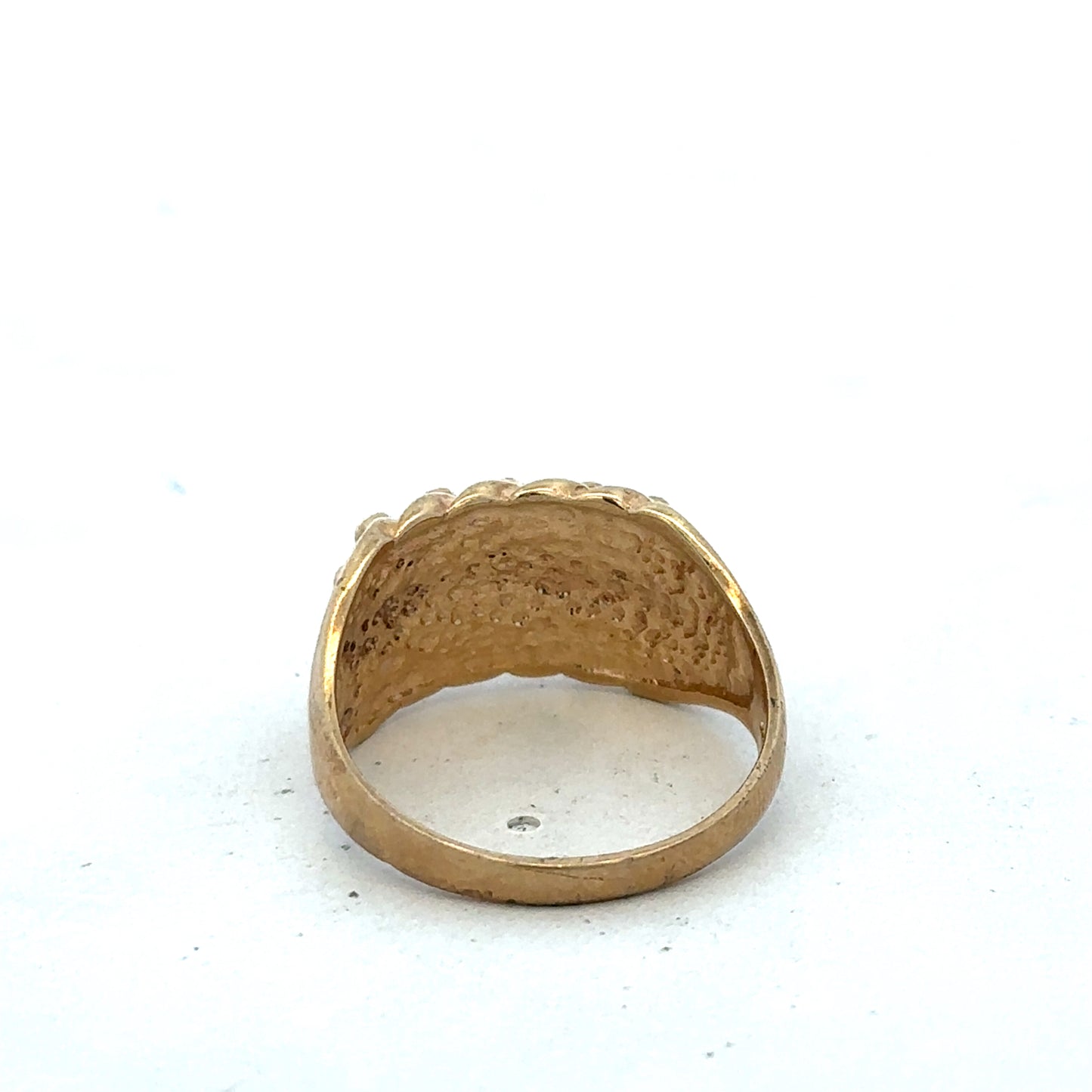 9ct yellow gold keeper ring size U by Reeves and Sons, close-up showing smooth band and polished finish.