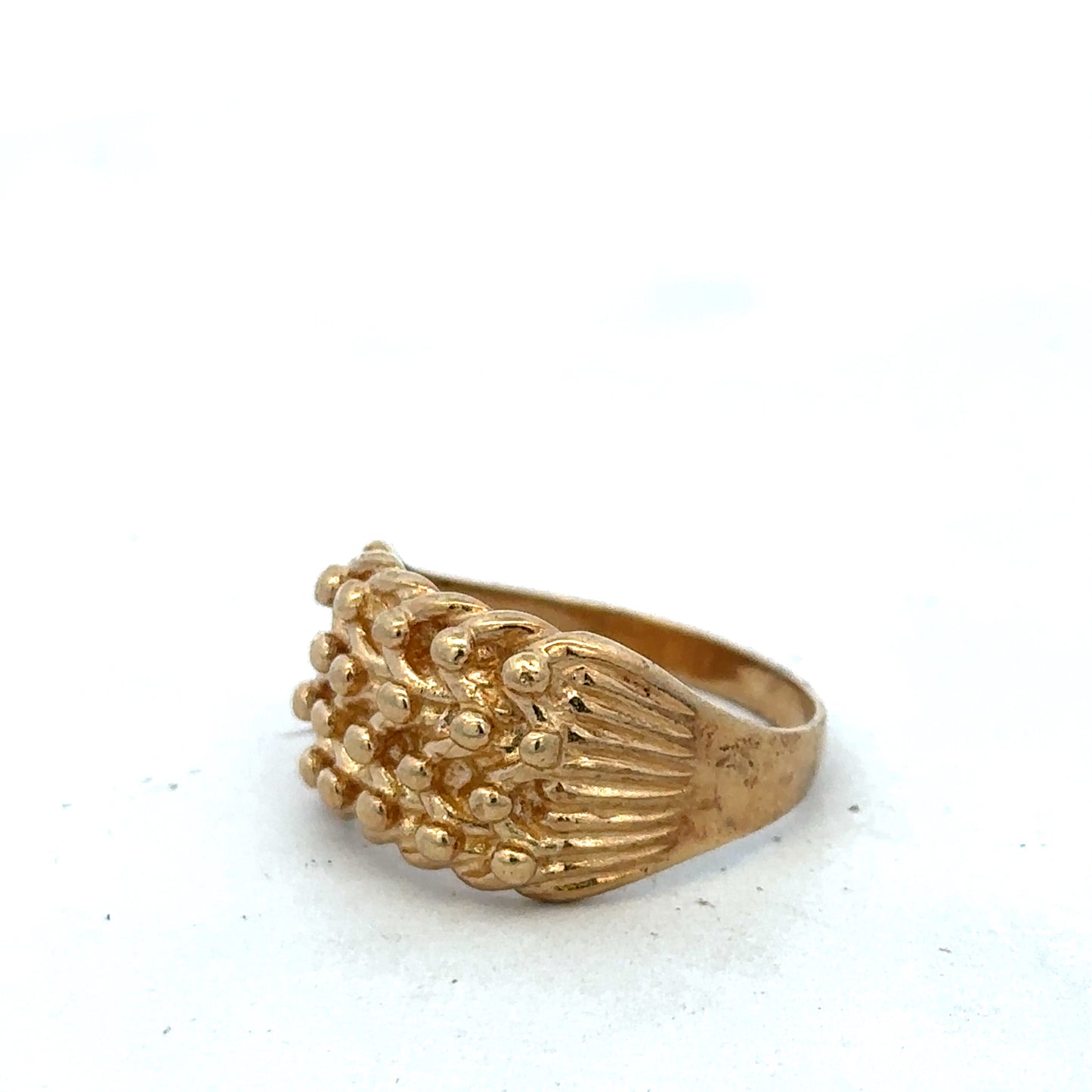 9ct yellow gold keeper ring in size U with a smooth band, crafted by Reeves and Sons, displayed on a neutral background.