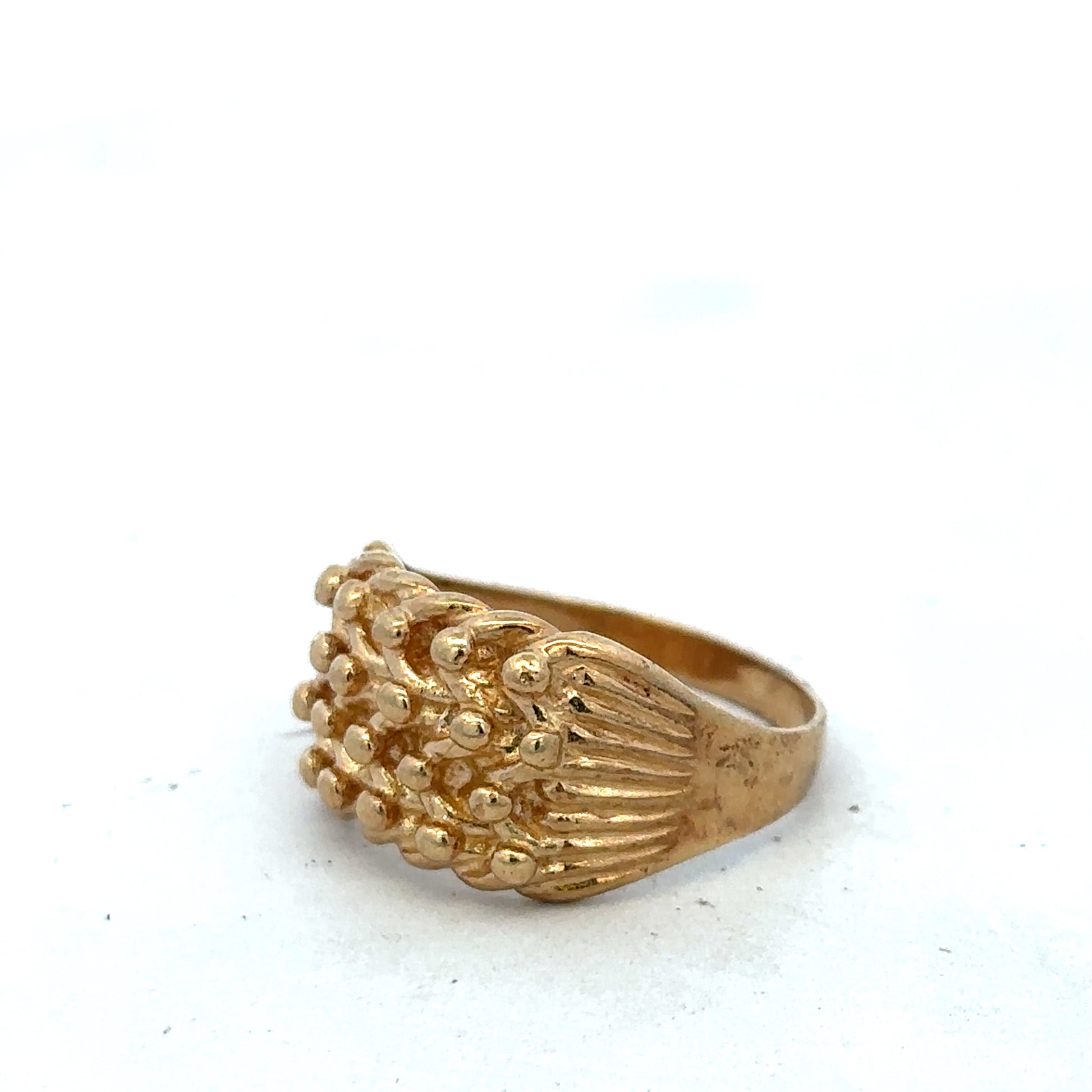 9ct yellow gold keeper ring in size U with a smooth band, crafted by Reeves and Sons, displayed on a neutral background.