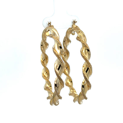 9ct yellow gold hoop earrings weighing 5.8g from Reeves and Sons, close-up of classic round hoop design with polished finish.