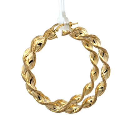 9ct yellow gold hoop earrings weighing 5.8g, featuring classic circular design from Reeves and Sons.