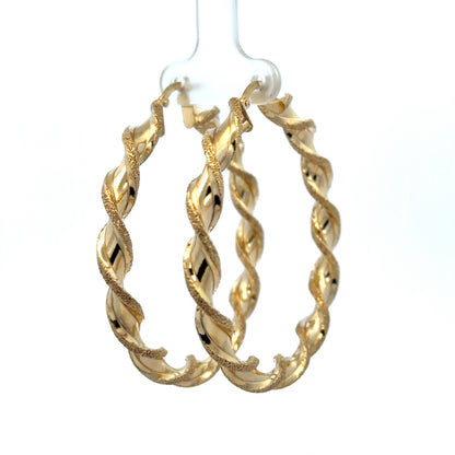 9ct yellow gold hoop earrings weighing 5.8g, featuring classic hoop design by Reeves and Sons.