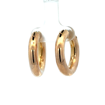 9ct yellow gold hoop earrings by Reeves and Sons, lightweight 4.5g, showcasing classic circular design and polished finish.