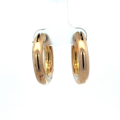 Reeves and Sons 9ct yellow gold hoop earrings with a 4.5g weight, showcasing classic round design and polished finish.