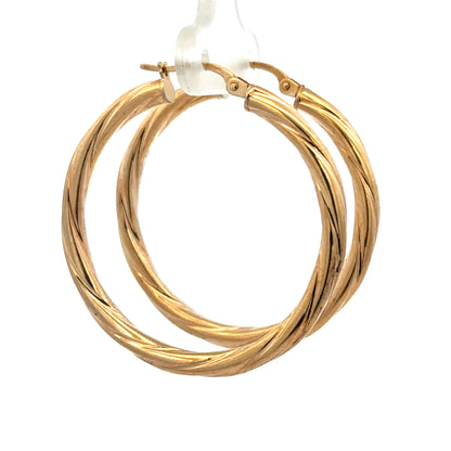 9ct yellow gold hoop earrings by Reeves and Sons, lightweight 2.5g, showing the classic round design and polished finish.