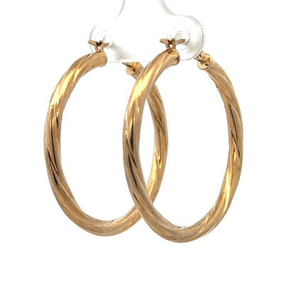 9ct yellow gold hoop earrings weighing 2.5g, featuring smooth, polished hoops from Reeves and Sons.