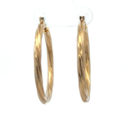 9ct yellow gold hoop earrings weighing 2.5g from Reeves and Sons, showcasing smooth, polished circular design.