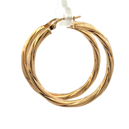 9ct yellow gold hoop earrings weighing 2.5g, featuring a classic circular design by Reeves and Sons.