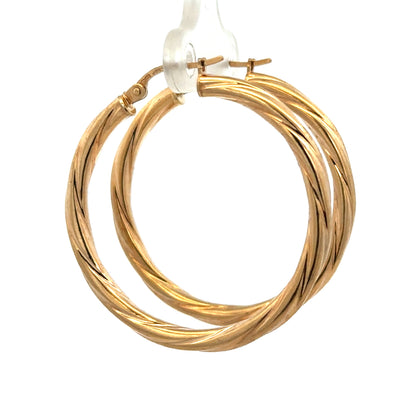 Reeves and Sons 9ct yellow gold hoop earrings, lightweight 2.5g, showcasing classic circular design and polished finish.