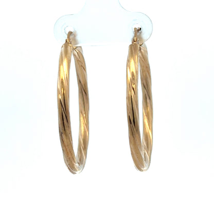 Reeves and Sons 9ct yellow gold hoop earrings, 2.5g, with a smooth polished finish, displayed against a neutral background.