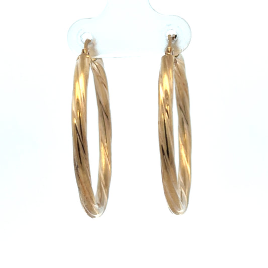 Reeves and Sons 9ct yellow gold hoop earrings, 2.5g, with a smooth polished finish, displayed against a neutral background.