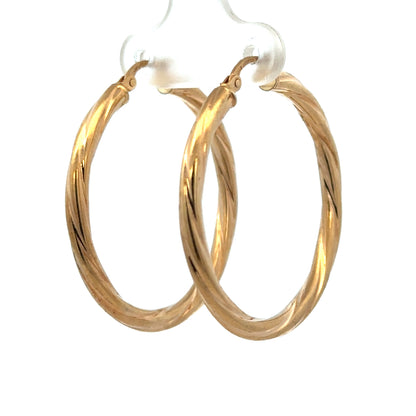Reeves and Sons 9ct yellow gold hoop earrings, lightweight 2.5g, featuring a classic circular design, shiny finish.