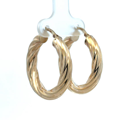 Reeves and Sons 9ct yellow gold hoop earrings, medium-sized, shiny, with a smooth polished finish, weighing 5.5g.