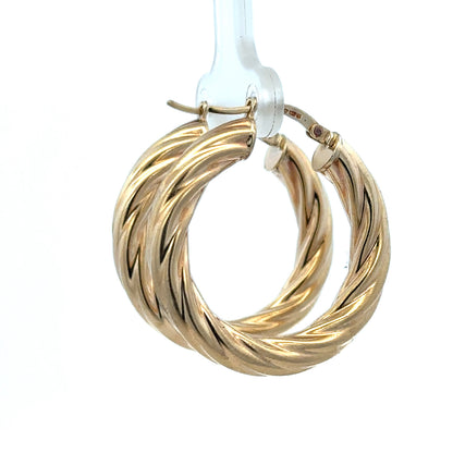 Reeves and Sons 9ct yellow gold hoop earrings, 5.5g, featuring smooth circular design and polished finish.