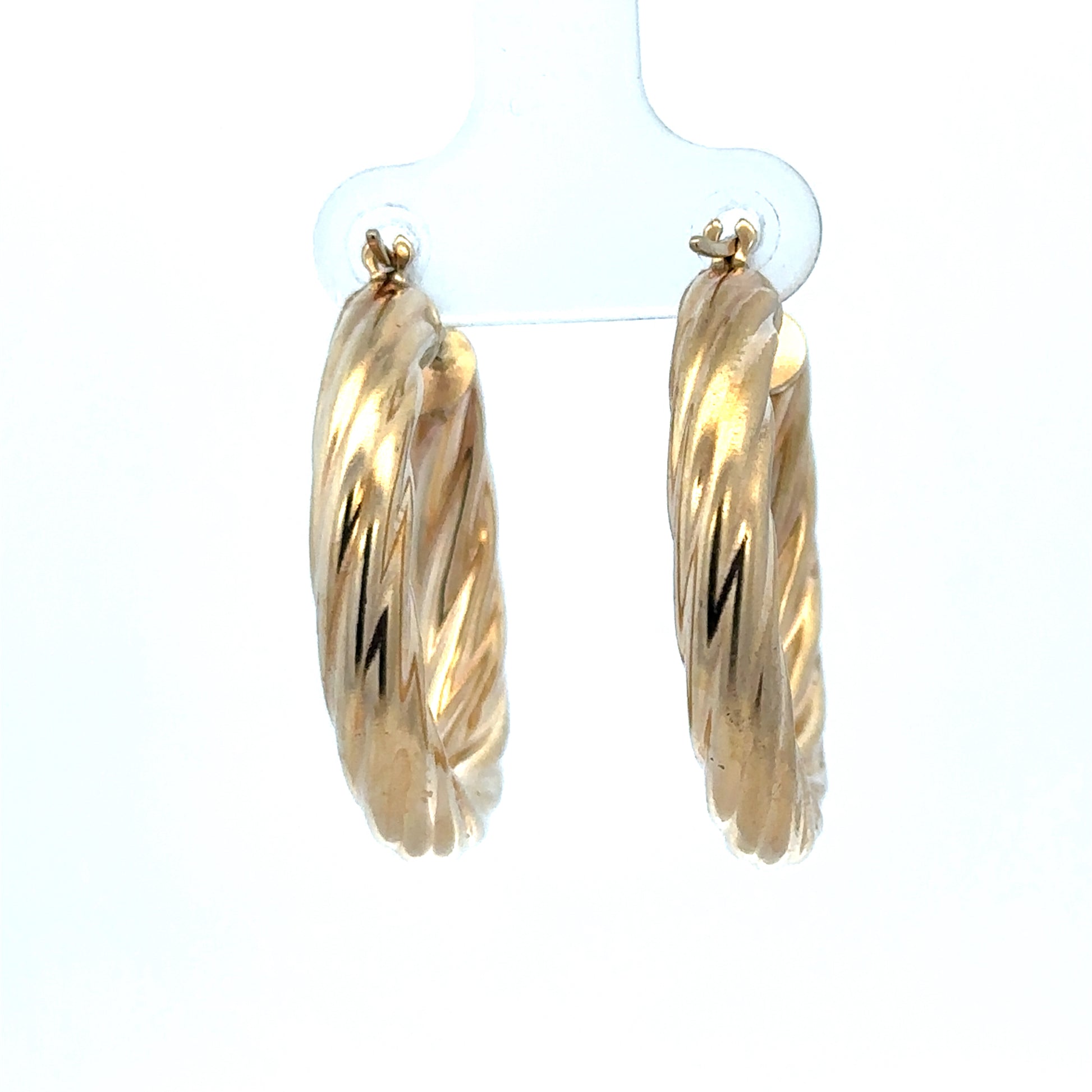 9ct yellow gold hoop earrings weighing 5.5g, stylish and classic jewelry from Reeves and Sons, shown in close-up image.