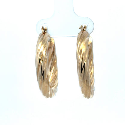 9ct yellow gold hoop earrings weighing 5.5g, stylish and classic jewelry from Reeves and Sons, shown in close-up image.