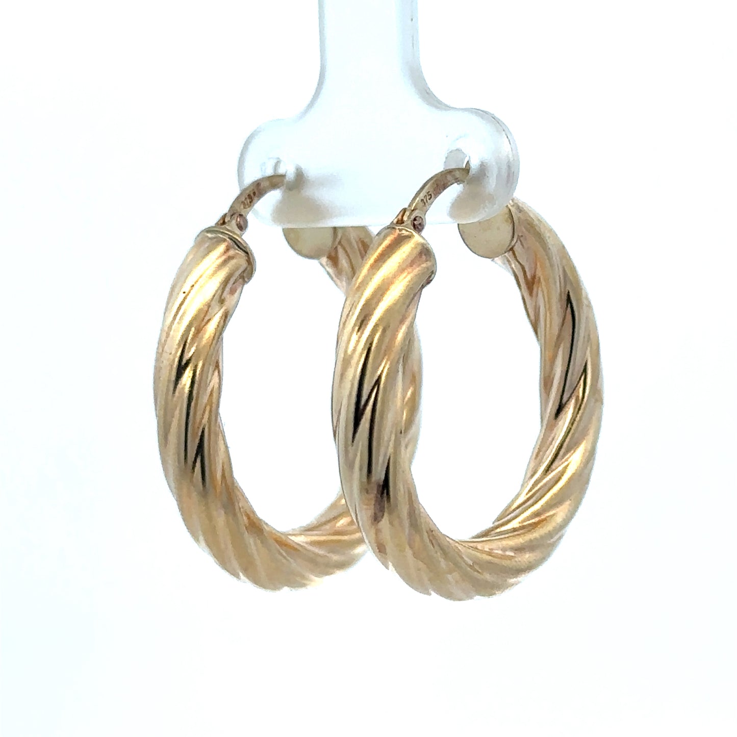9ct yellow gold hoop earrings with a 5.5g weight, showcasing classic round design from Reeves and Sons.