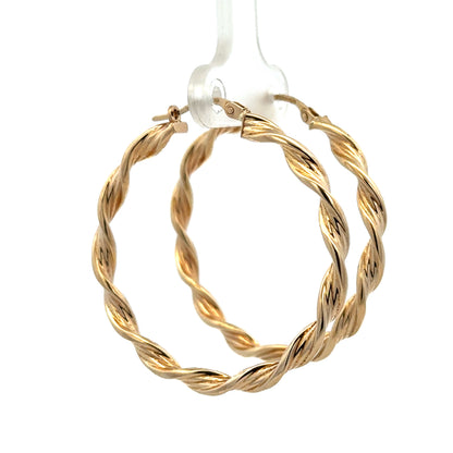 9ct yellow gold hoop earrings weighing 3g, featuring a classic circular design with polished finish, by Reeves and Sons.