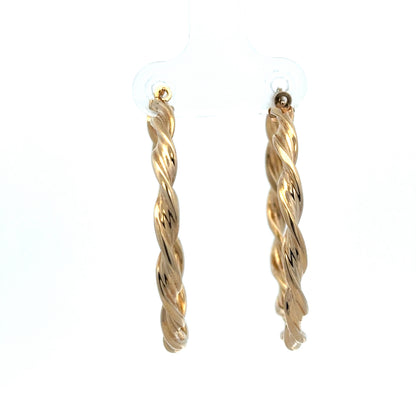 9ct yellow gold hoop earrings weighing 3g, stylish and shiny, from Reeves and Sons, shown in a close-up image.
