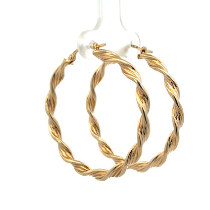 9ct yellow gold hoop earrings weighing 3g from Reeves and Sons, with a smooth circular design and polished finish.