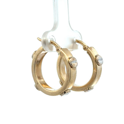 9ct yellow gold hoop earrings by Reeves and Sons, lightweight and elegant, shown in a close-up image.