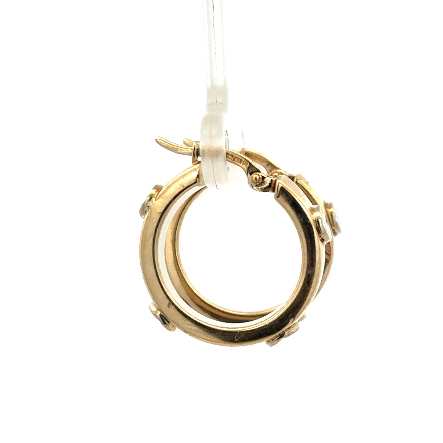 9ct yellow gold hoop earrings weighing 2.9g, shiny and smooth, from Reeves and Sons, shown in a close-up image.