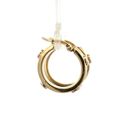 9ct yellow gold hoop earrings weighing 2.9g, shiny and smooth, from Reeves and Sons, shown in a close-up image.
